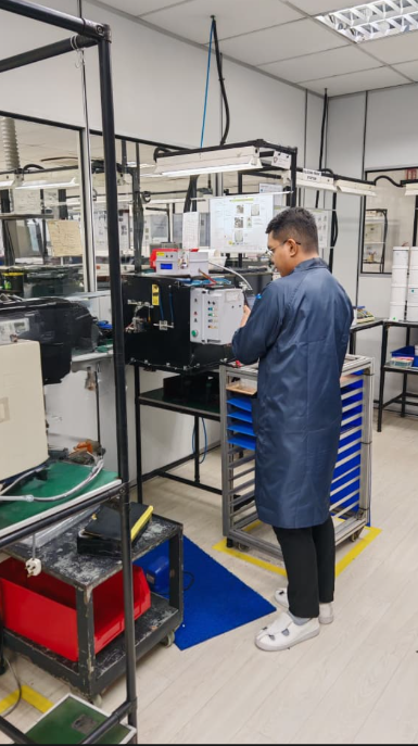 Engineering work beside an industrial testing machine